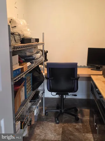 a view of a workspace with furniture