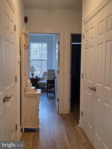 a view of a livingroom with hardwood floor and a window
