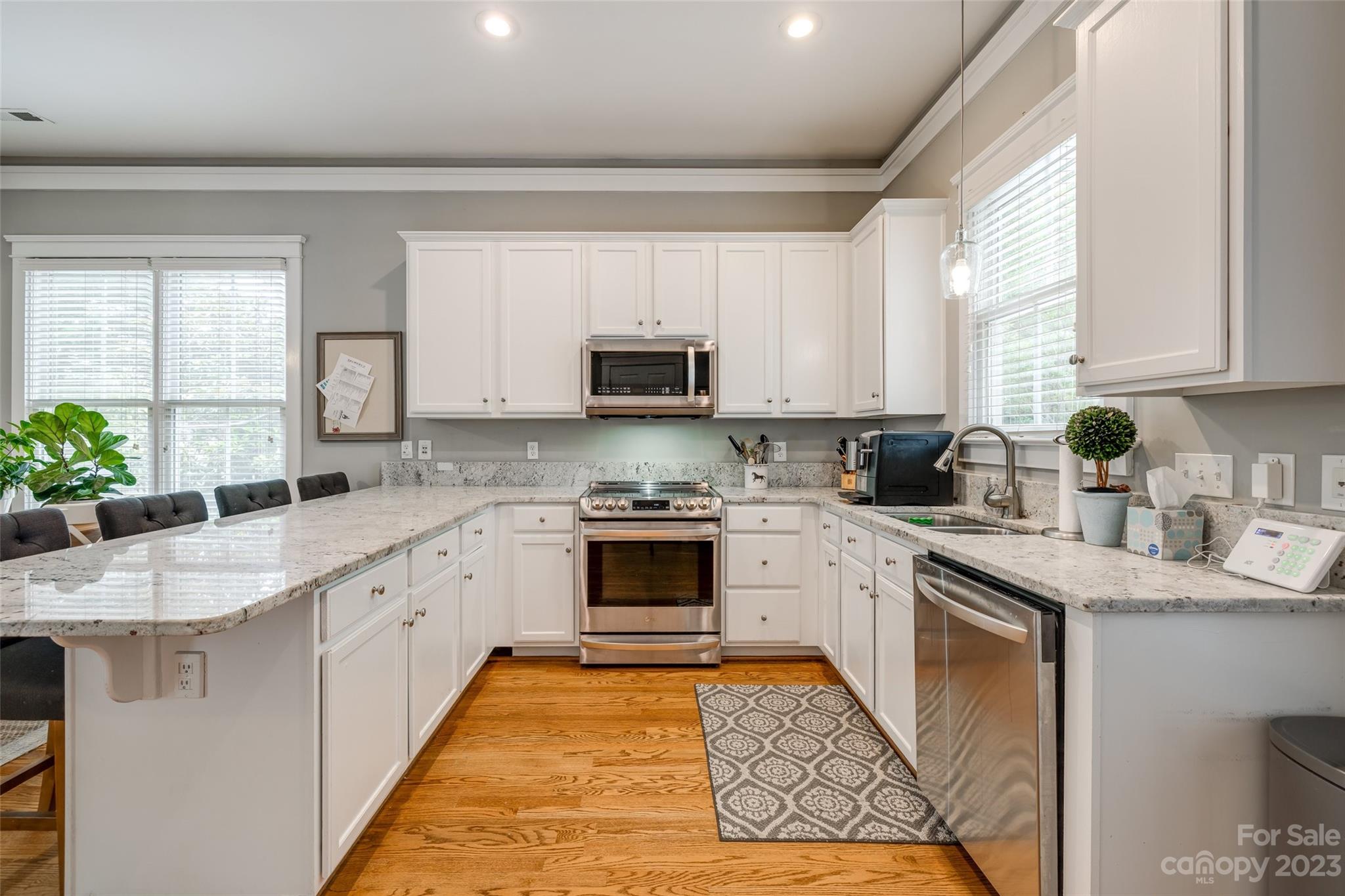 3292 Richard's Crossing Fort Mill, SC 29708 - Photo 17 of 39 a kitchen with granite countertop white cabinets and white appliances
