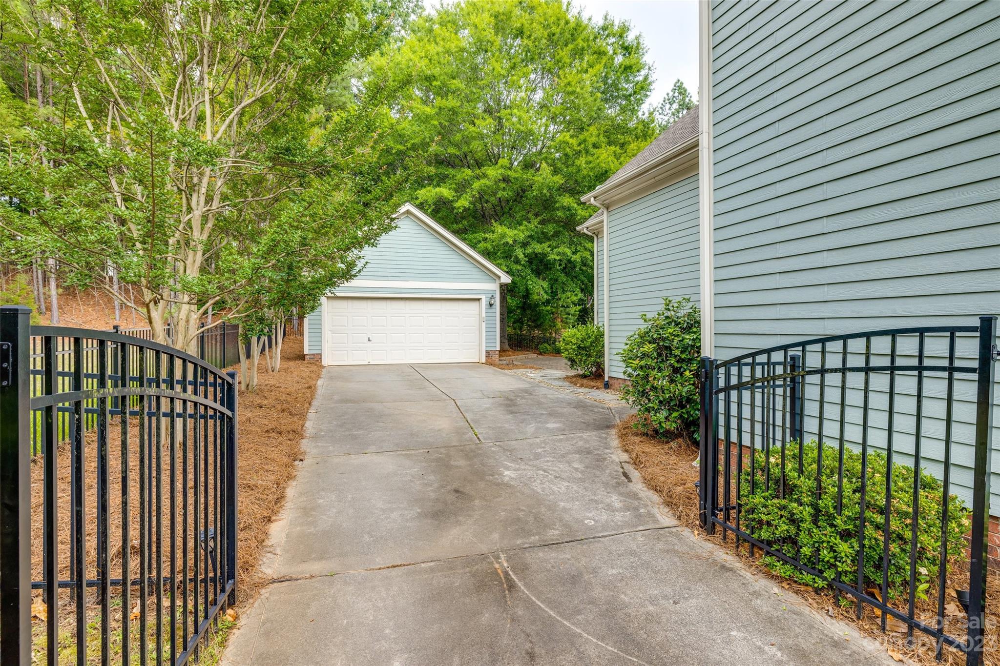 3292 Richard's Crossing Fort Mill, SC 29708 - Photo 33 of 39 a view of a house with a small yard and a large tree