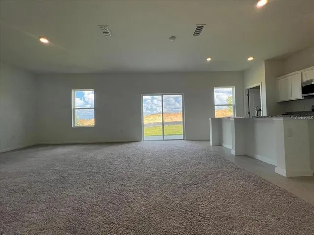a view of empty room with a window