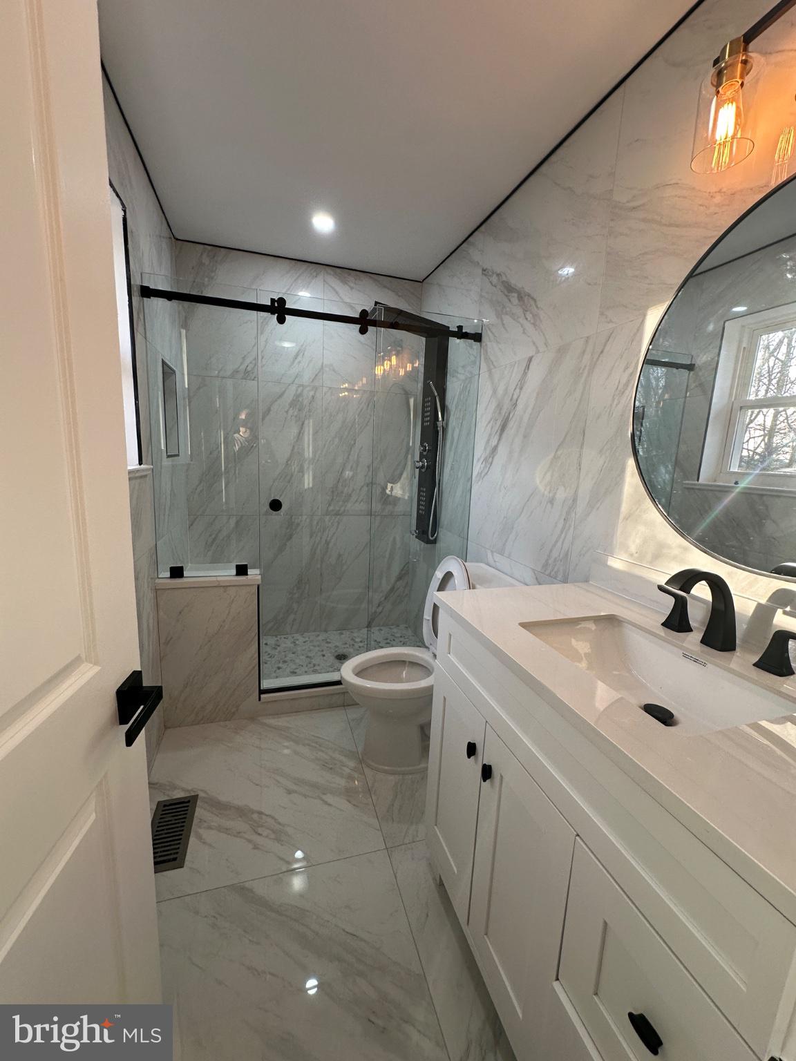 14 Buttonwood Road Voorhees, NJ 08043 - Photo 17 of 35 Sleek marble bathroom with modern fixtures.