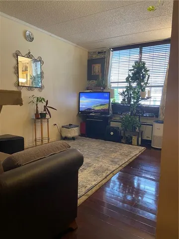 a bedroom with a bed and a potted plant