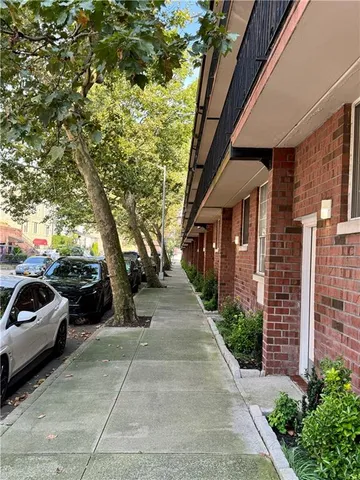 a view of a car parked in front of a building