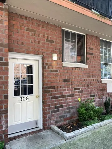 a view of front door of house and yard