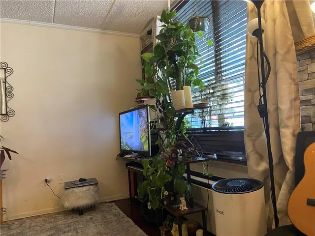 a bathroom with a toilet a sink and a window