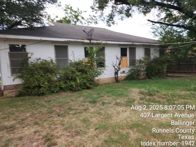 407 Largent Avenue Ballinger, TX 76821 - Photo 14 of 17 Rear view of property featuring a shingled roof
