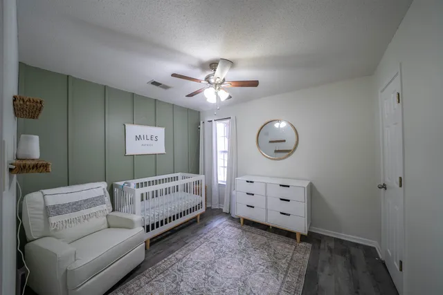 a bedroom with furniture and a window