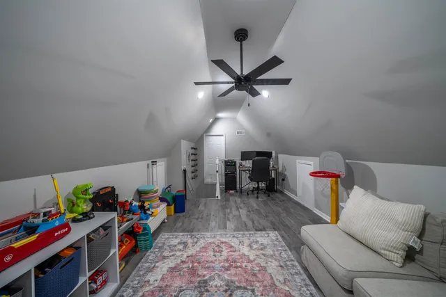 a view of a room with toys and wooden floor