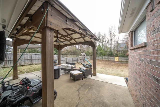 a view of living room filled with furniture and a rug