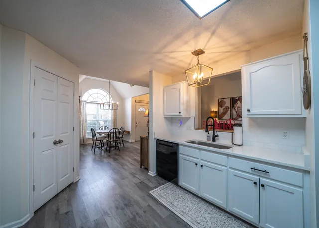 a view of a livingroom with furniture window and wooden floor