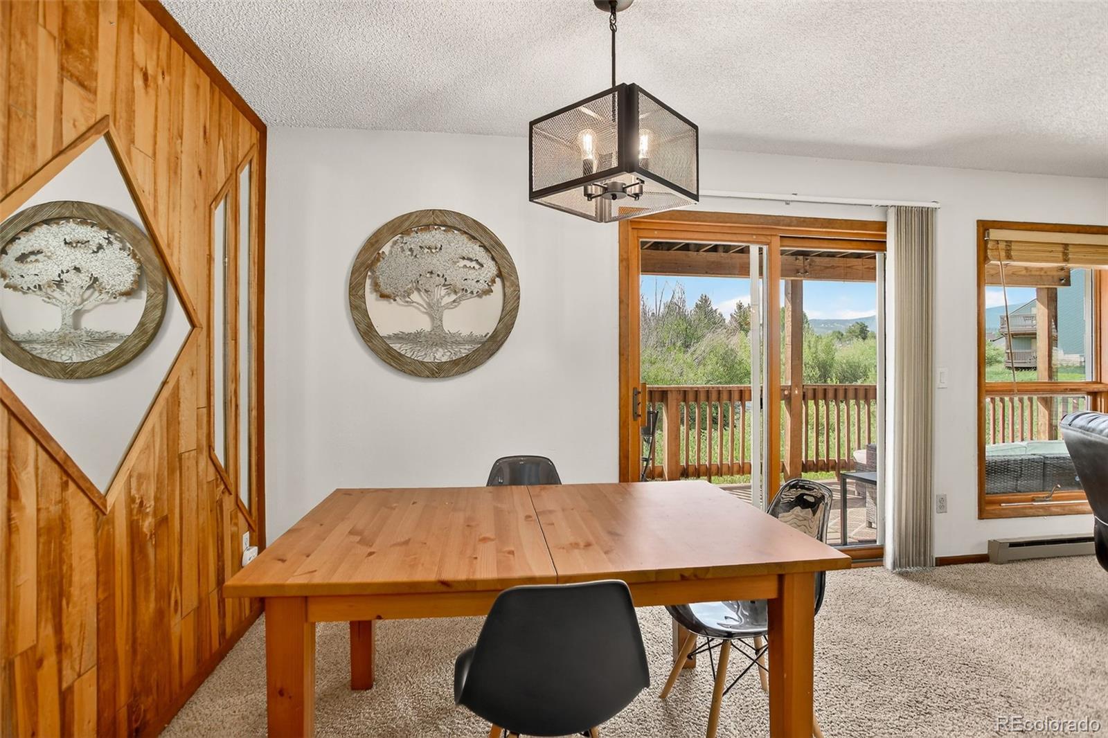 300 Sterling Way, Unit 2 Fraser, CO 80442 - Photo 11 of 28 a view of a dining room with furniture window and outside view