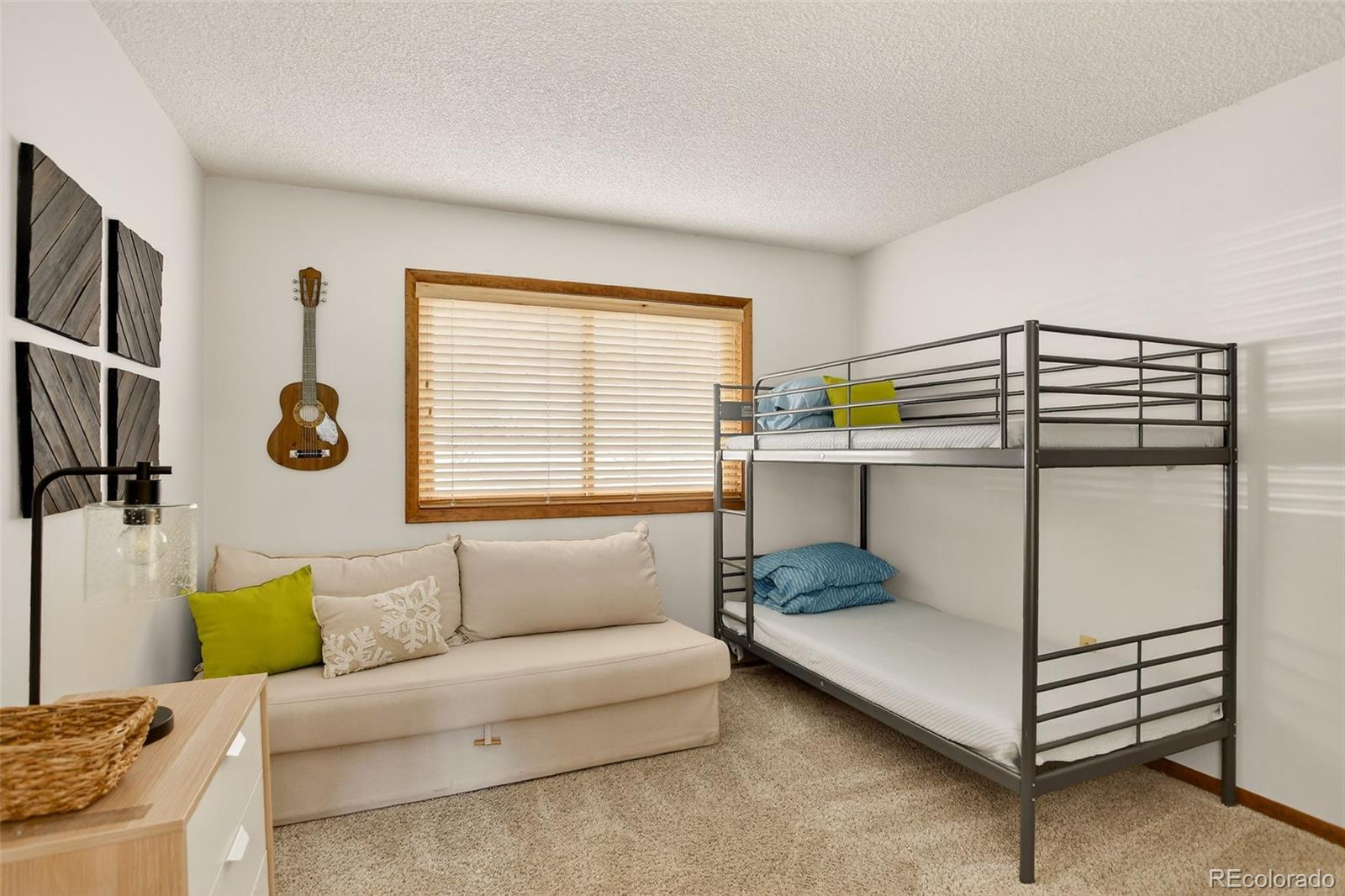 300 Sterling Way, Unit 2 Fraser, CO 80442 - Photo 21 of 28 a bedroom with a bed and a window