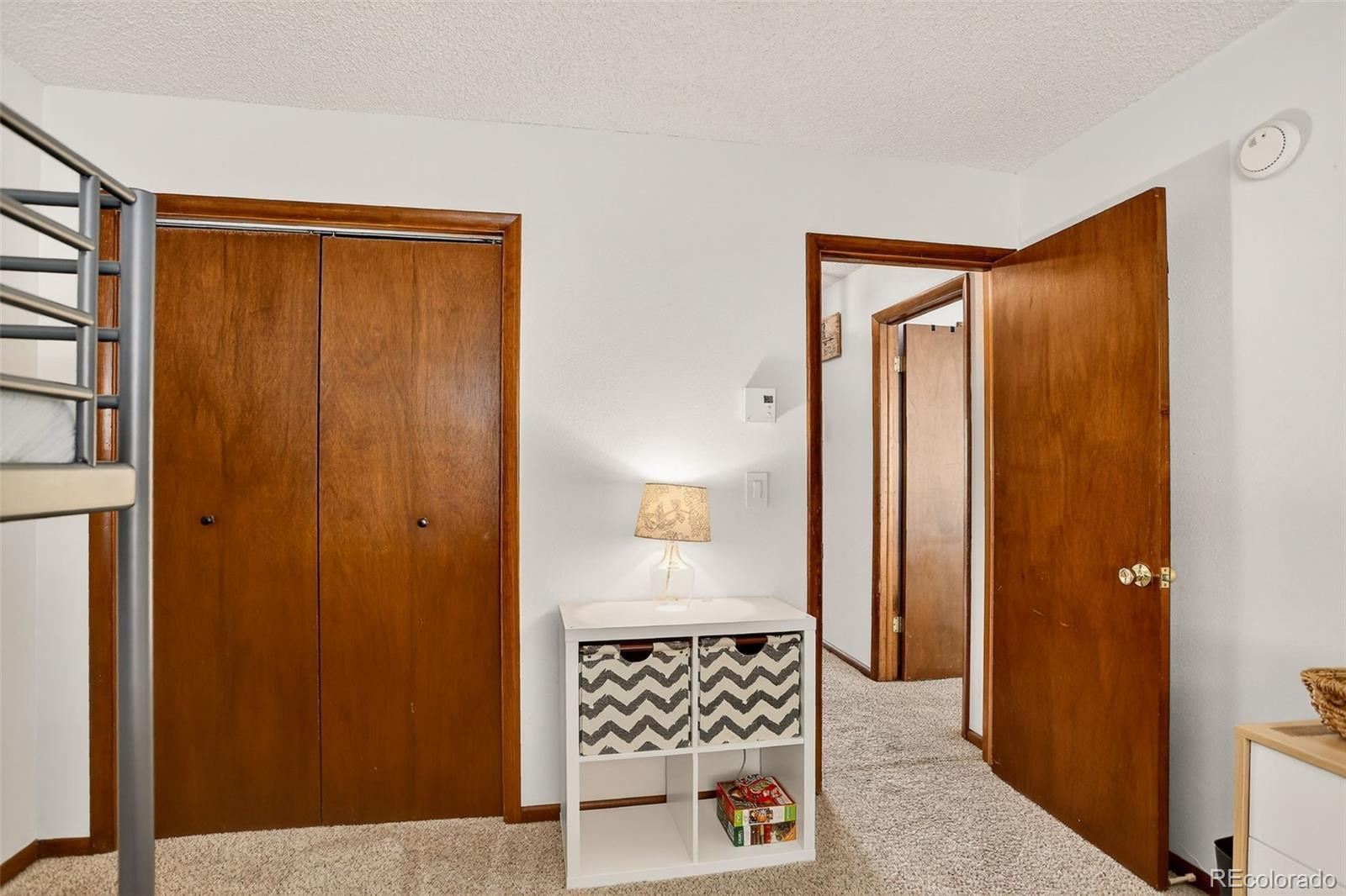 300 Sterling Way, Unit 2 Fraser, CO 80442 - Photo 22 of 28 a view of a hallway with wooden floor and cabinet