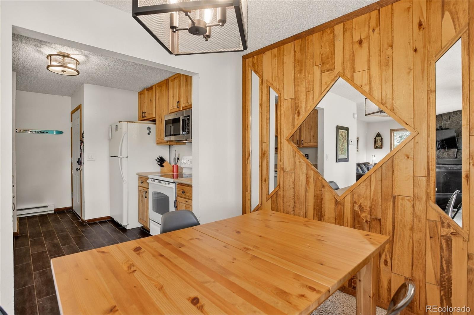 300 Sterling Way, Unit 2 Fraser, CO 80442 - Photo 10 of 28 a bedroom with a bed and wooden floor