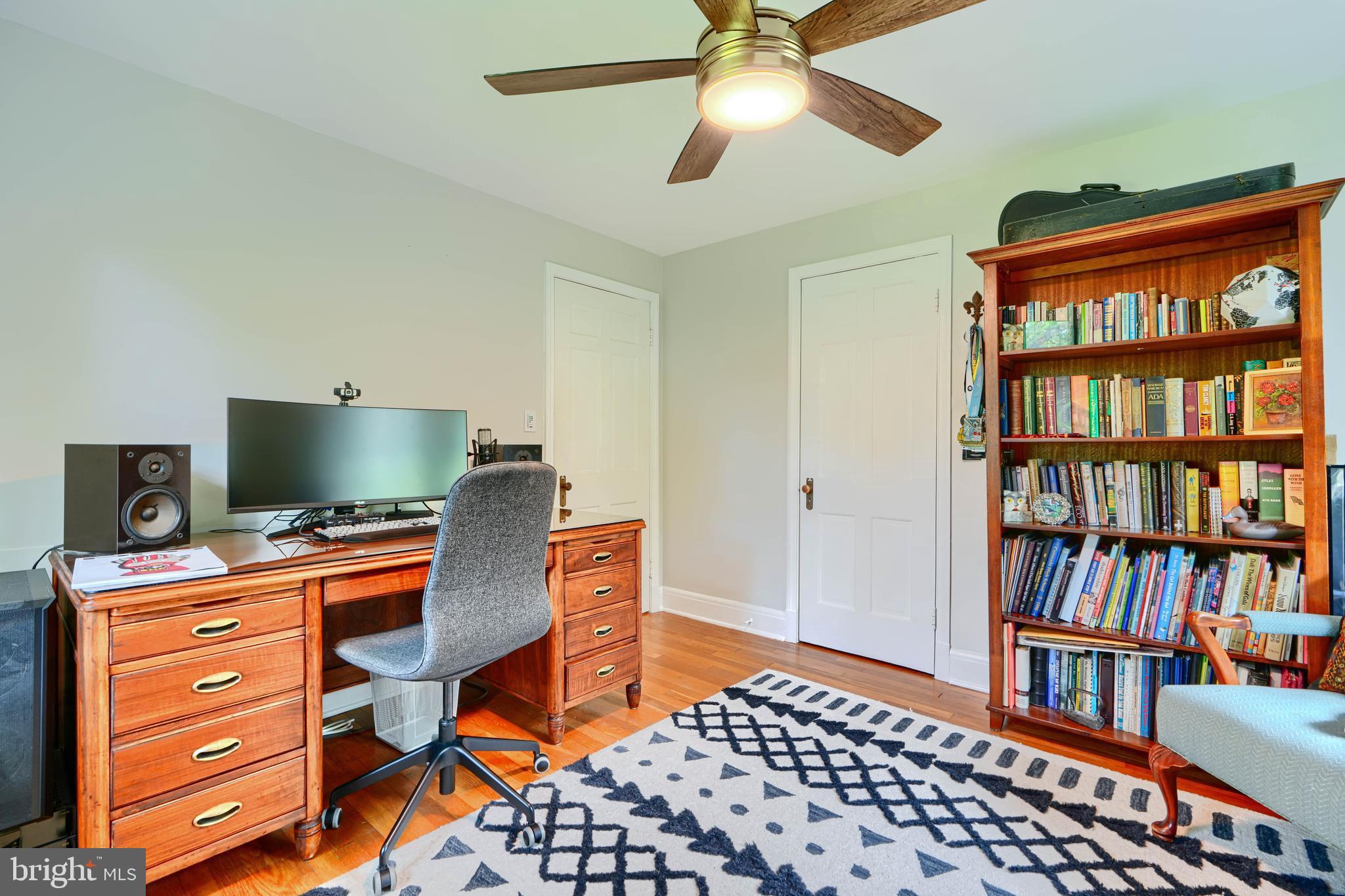 1310 Providence Road Baltimore, MD 21286 - Photo 17 of 31 a view of a workspace with furniture and a bookshelf