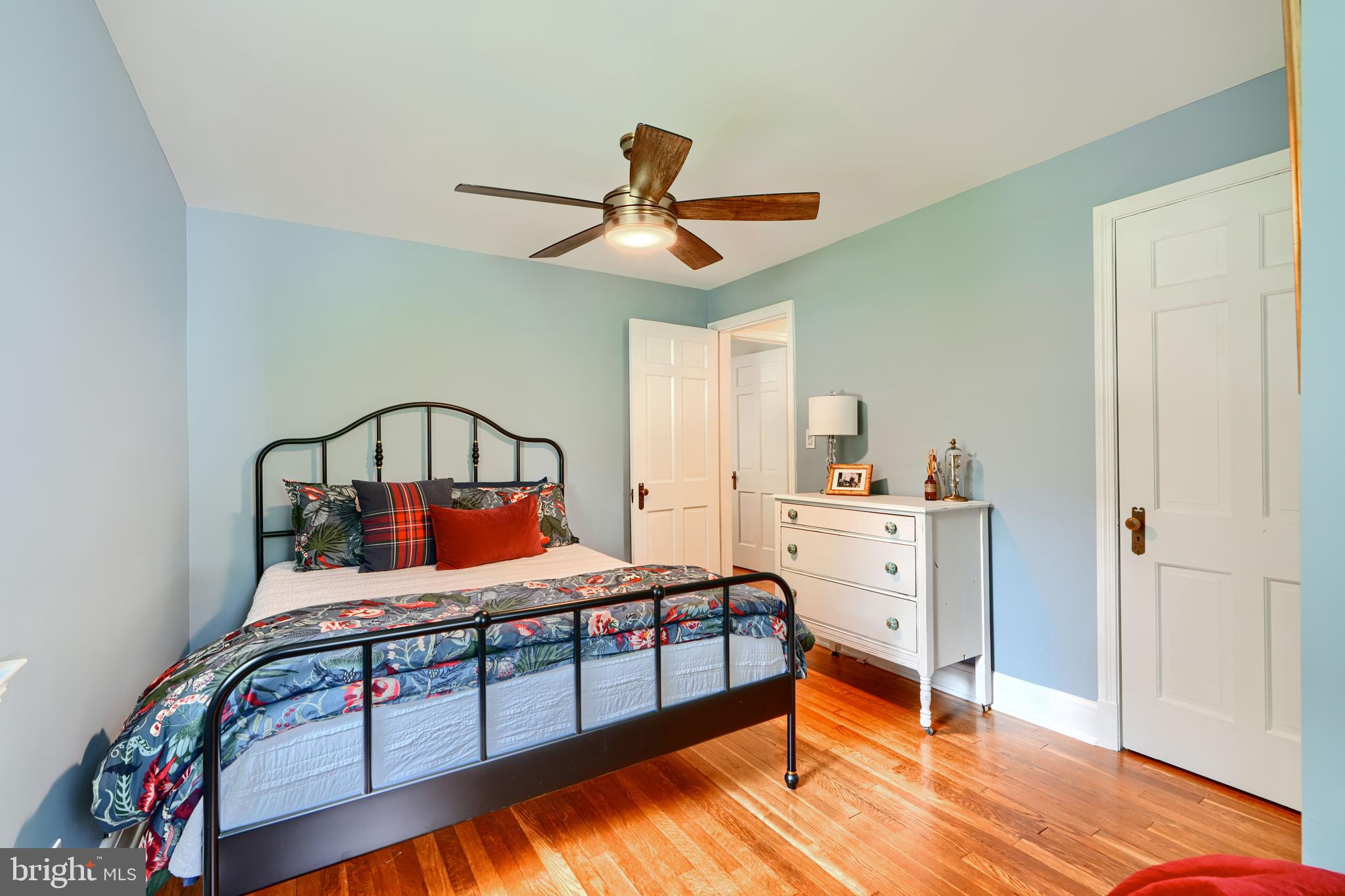 1310 Providence Road Baltimore, MD 21286 - Photo 19 of 31 a bedroom with a bed and a chandelier