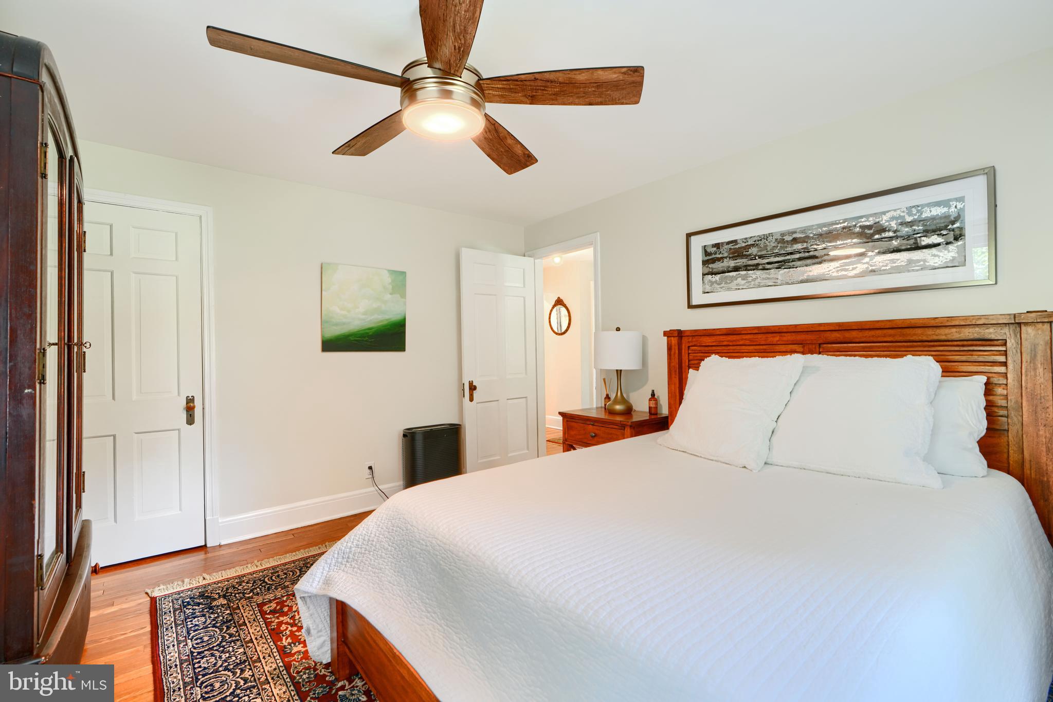 1310 Providence Road Baltimore, MD 21286 - Photo 21 of 31 a bedroom with a bed and a chandelier