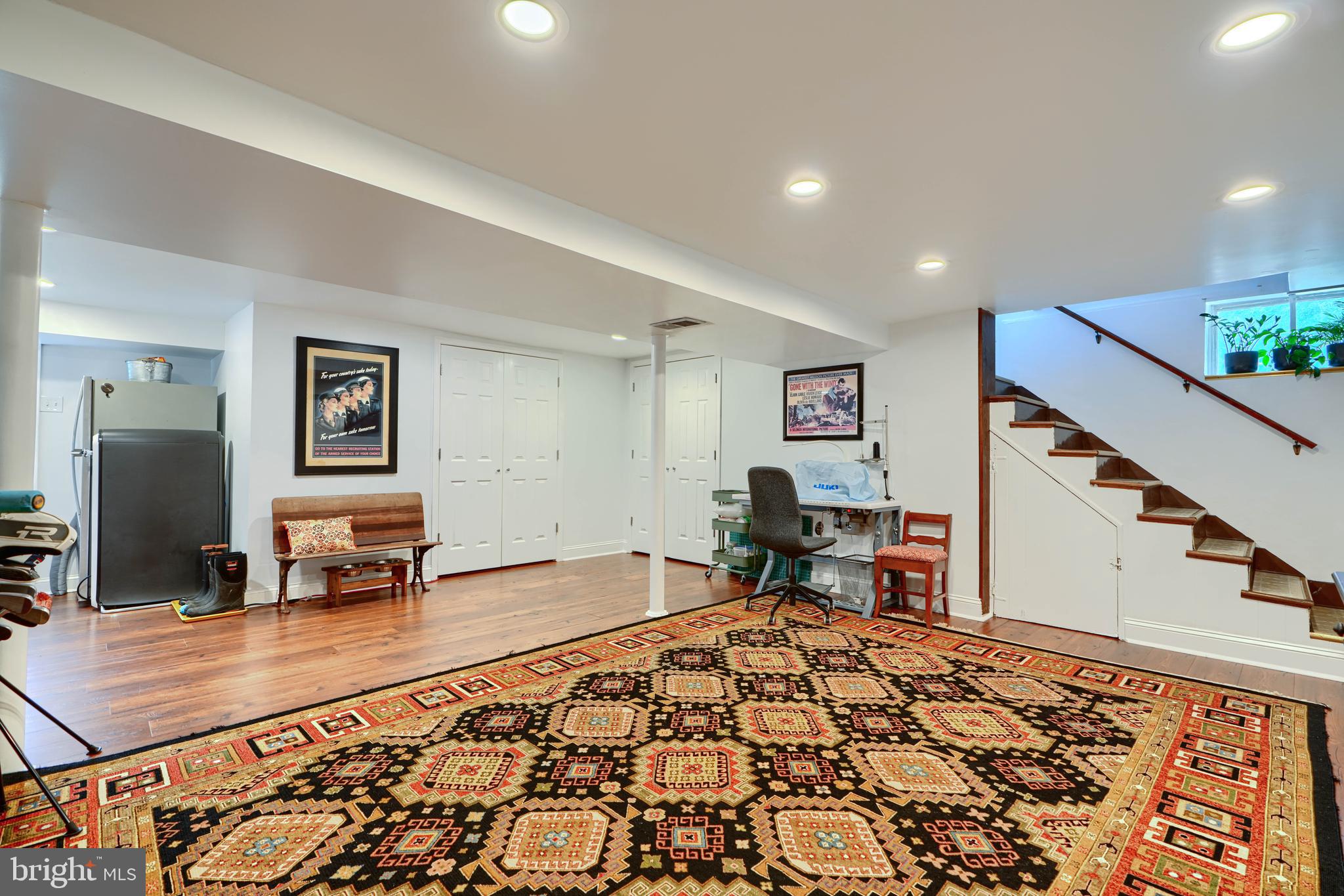 1310 Providence Road Baltimore, MD 21286 - Photo 25 of 31 a living room with a couch and a dresser with wooden floor