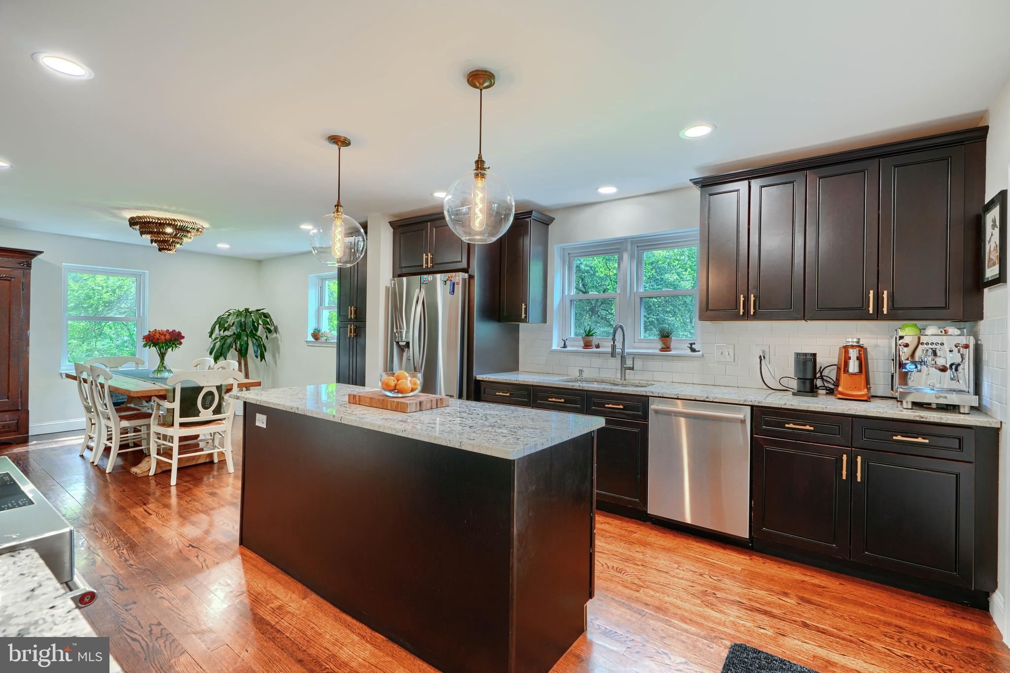 1310 Providence Road Baltimore, MD 21286 - Photo 9 of 31 a kitchen with granite countertop a sink cabinets and wooden floor