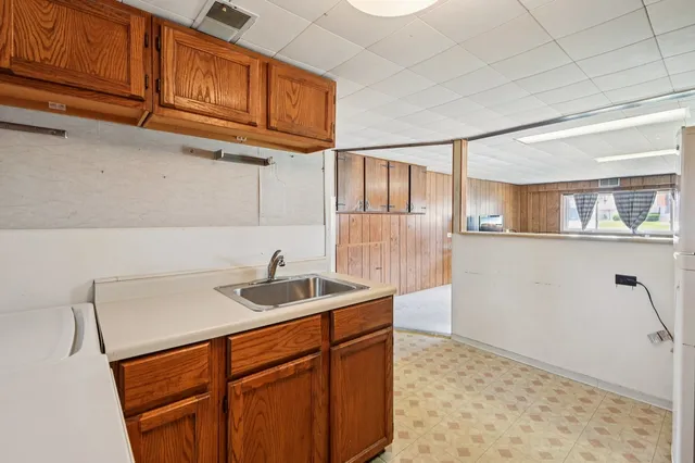 a kitchen with stainless steel appliances granite countertop a sink and cabinets