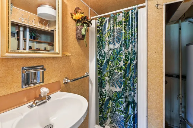 a bathroom with a sink and a mirror