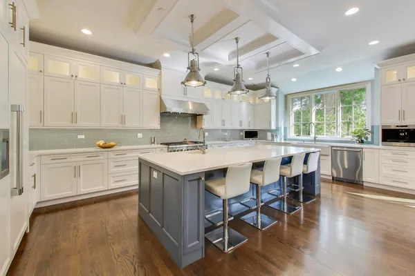 a utility room with cabinets washer and dryer