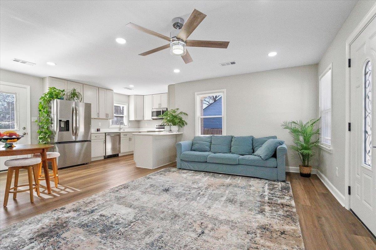4461 Boyce Road Memphis, TN 38117 - Photo 2 of 17 a living room with furniture and kitchen view with wooden floor