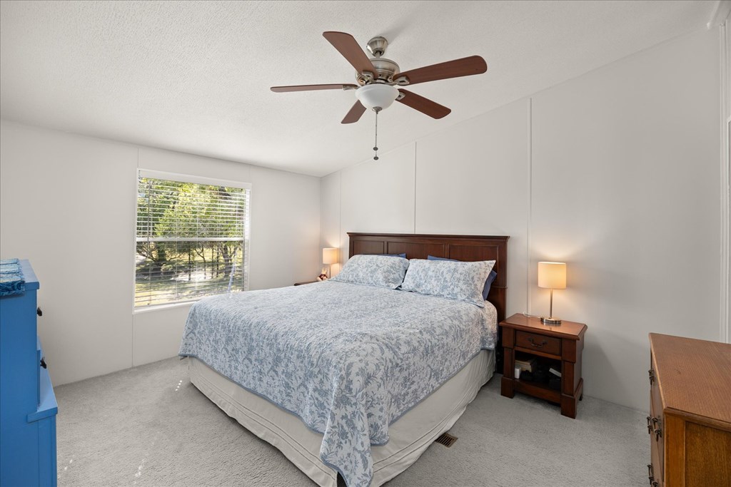 363 Elm Pass 2 Center Point, TX 78010 - Photo 22 of 60 a bedroom with a bed and window