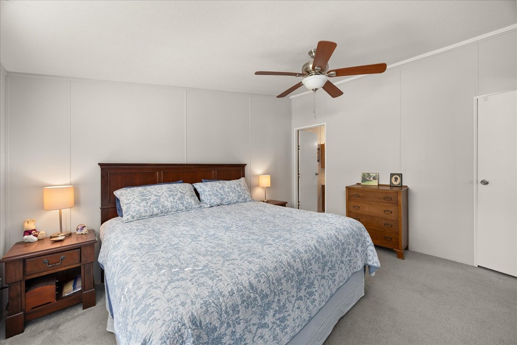 363 Elm Pass 2 Center Point, TX 78010 - Photo 23 of 60 a bedroom with a bed and a lamp