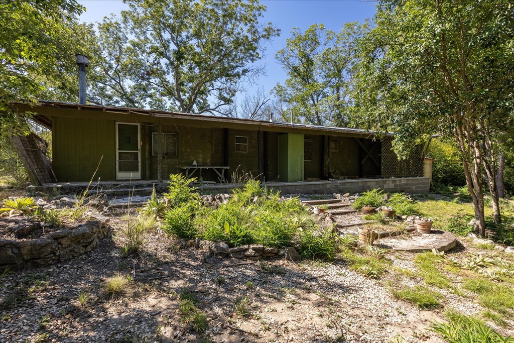 363 Elm Pass 2 Center Point, TX 78010 - Photo 52 of 60 a front view of house with yard and trees in the background