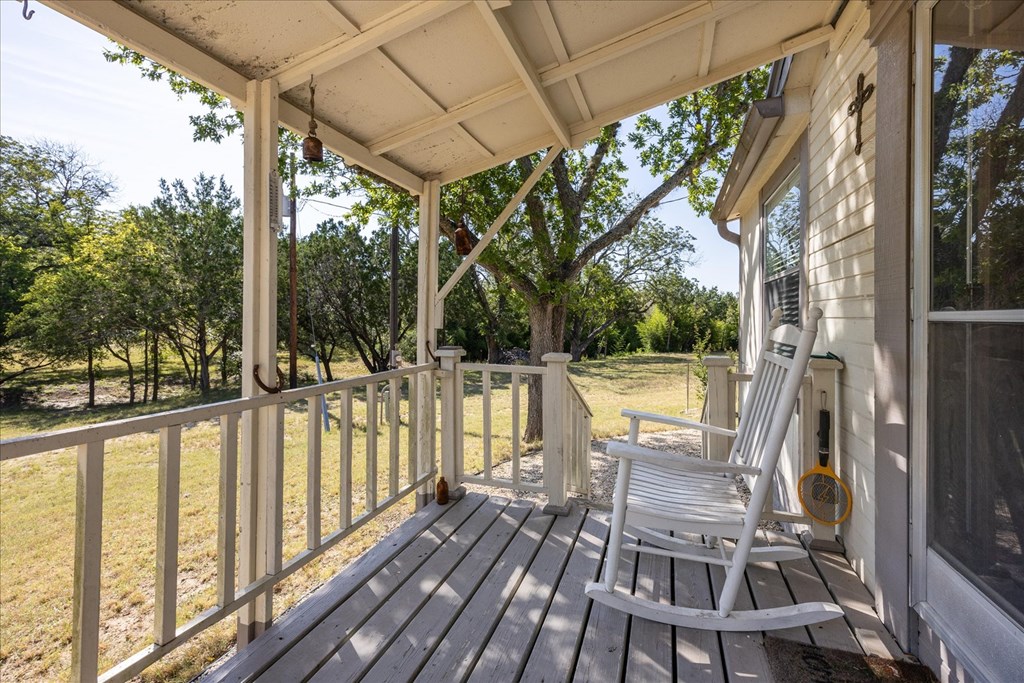 363 Elm Pass 2 Center Point, TX 78010 - Photo 9 of 60 a view of balcony with wooden floor and outdoor seating