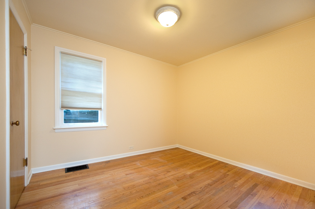 231 East Harrison Road Lombard, IL 60148 - Photo 12 of 16 an empty room with wooden floor and windows