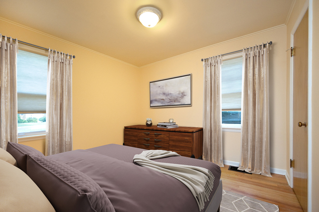 231 East Harrison Road Lombard, IL 60148 - Photo 13 of 16 a bedroom with a bed and a window