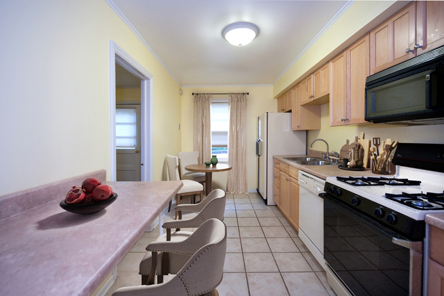 231 East Harrison Road Lombard, IL 60148 - Photo 3 of 16 a kitchen with sink a stove and cabinets