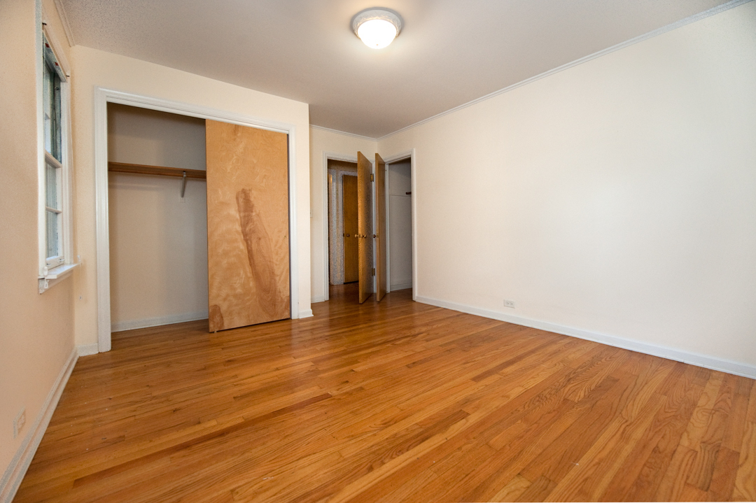 231 East Harrison Road Lombard, IL 60148 - Photo 9 of 16 an empty room with wooden floor and closet