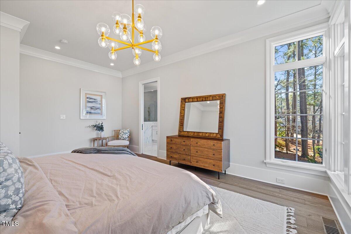4906 Tremont Drive Raleigh, NC 27609 - Photo 26 of 78 a bedroom with a bed and a window