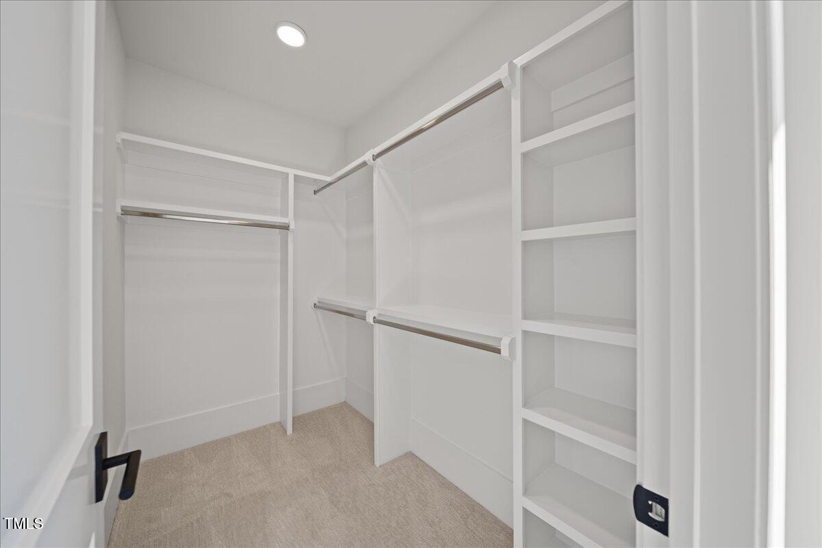 4906 Tremont Drive Raleigh, NC 27609 - Photo 33 of 78 a view of an empty walk in closet