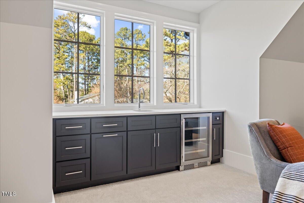 4906 Tremont Drive Raleigh, NC 27609 - Photo 38 of 78 a view of room with furniture and windows