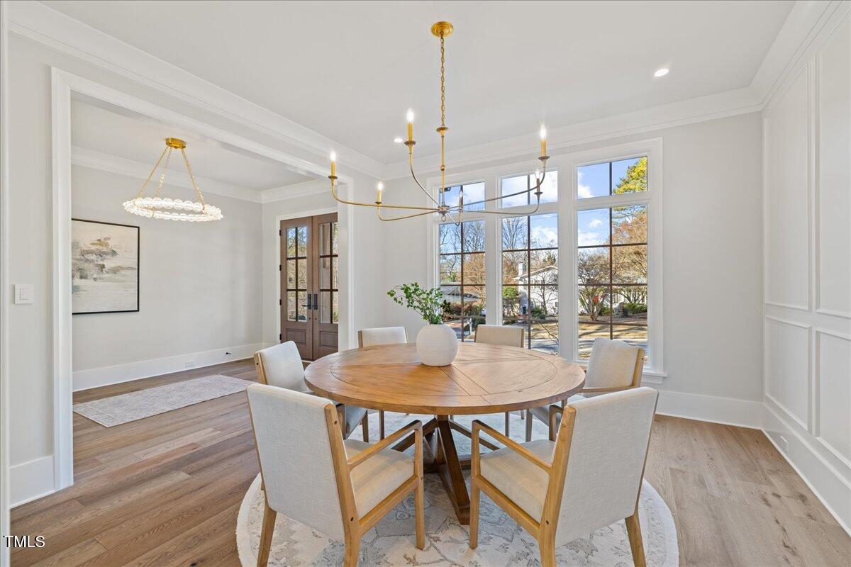 4906 Tremont Drive Raleigh, NC 27609 - Photo 8 of 78 a view of a dining room with furniture and wooden floor