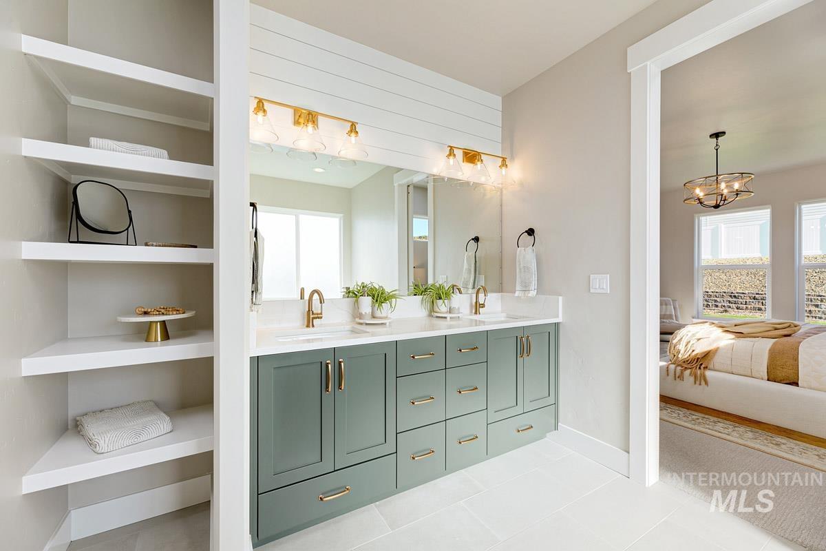 6792 Saddle Bred Way Star, ID 83669 - Photo 12 of 33 Bathroom featuring double vanity, ensuite bathroom, and light tile patterned floors