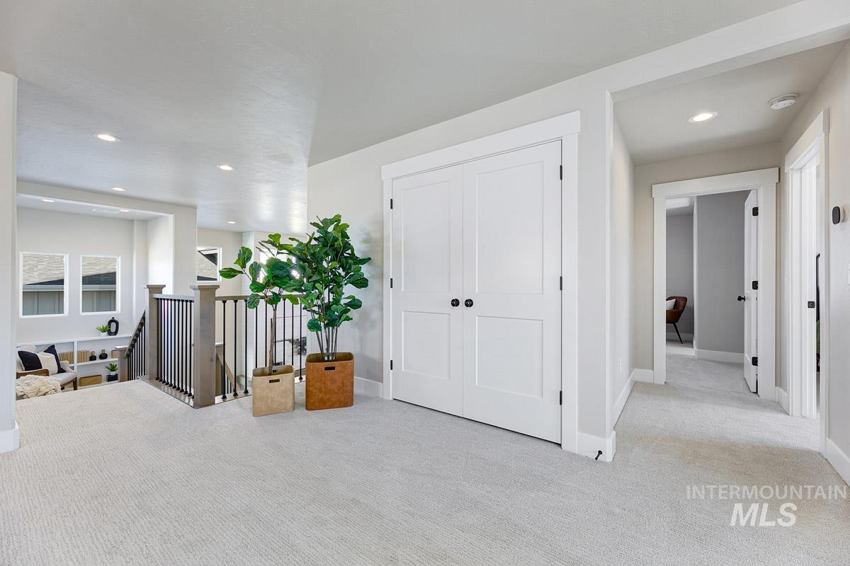 6792 Saddle Bred Way Star, ID 83669 - Photo 15 of 33 Hallway featuring an upstairs landing, recessed lighting, and carpet