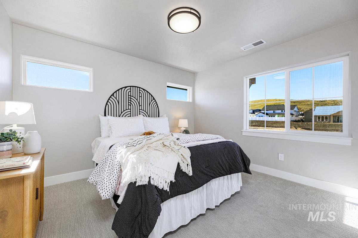 6792 Saddle Bred Way Star, ID 83669 - Photo 16 of 33 Carpeted bedroom featuring baseboards