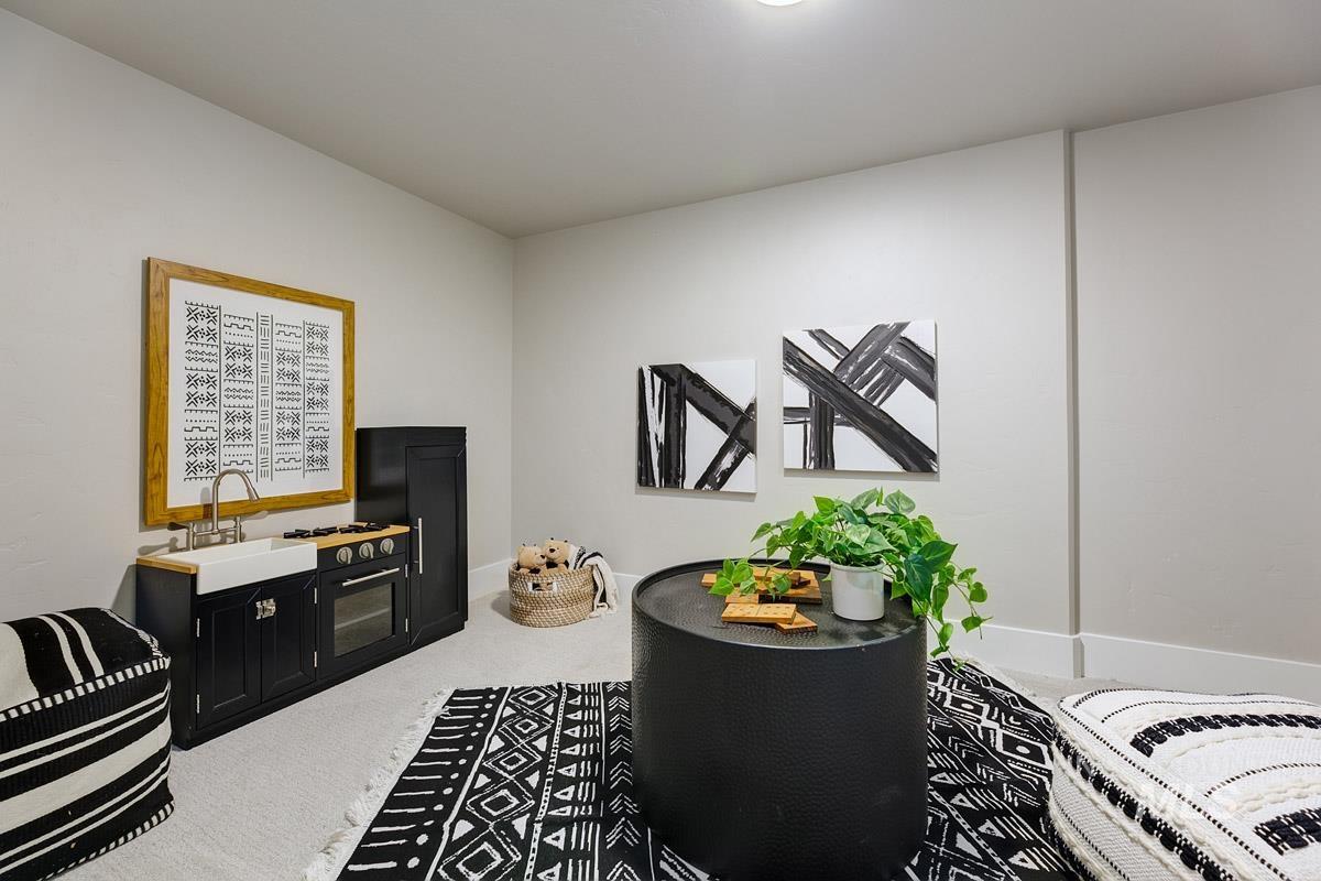 6792 Saddle Bred Way Star, ID 83669 - Photo 20 of 33 Living area with light carpet and baseboards