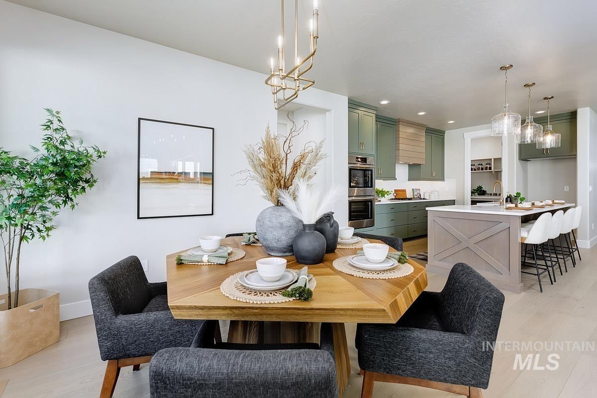 6792 Saddle Bred Way Star, ID 83669 - Photo 9 of 33 Dining room with light wood-type flooring and recessed lighting
