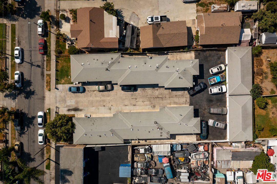 1307 East Peck Street Compton, CA 90221 - Photo 9 of 9 an aerial view of multiple houses with outdoor space