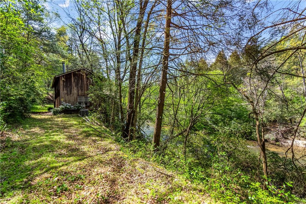 80 Riverbend Circle Ellijay, GA 30536 - Photo 10 of 32 a backyard of a house with lots of green space
