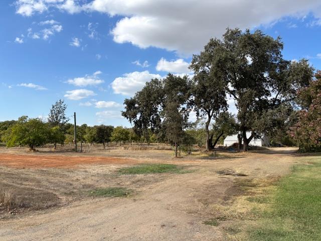 3760 Gallagher Road Rio Oso, CA 95674 - Photo 2 of 8 a view of dirt yard with a trampoline