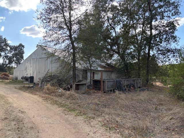 3760 Gallagher Road Rio Oso, CA 95674 - Photo 8 of 8 a backyard of a house with lots of green space and wooden fence