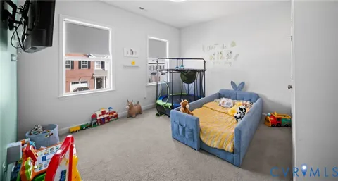 a bed room with a bed and a couch